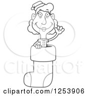 Clipart Of A Black And White Grandma Christmas Elf Waving In A Stocking Royalty Free Vector Illustration by Cory Thoman