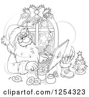 Black And White Santa Claus Responding To Christmas Emails On A Laptop