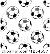 Clipart Of A Seamless Pattern Background Of Black And White Soccer Balls Royalty Free Vector Illustration