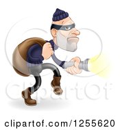 Poster, Art Print Of Caucasian Male Burglar Shining A Flashlight