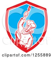 Retro Woodcut Revolutionary Chef With A Spatula And Frying Pan In A Shield