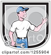 Poster, Art Print Of Cartoon Male Mechanic Holding A Spanner Wrench And Waving In A Shield