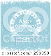 Poster, Art Print Of Blue Winter Background With Merry Christmas And A Happy New Year Text On A Wreath