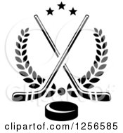Clipart Of Black And White Crossed Ice Hockey Sticks And A Puck Over Laurels Royalty Free Vector Illustration