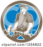 Poster, Art Print Of Retro Union Worker Carrying A Sledgehammer In A Brown White And Blue Circle