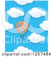 Poster, Art Print Of Hot Air Balloon Over A Cloudy Sky