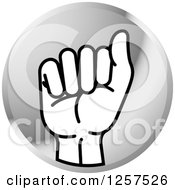 Clipart Of A Round Silver Icon Of A Sign Language Hand Gesturing Letter A Royalty Free Vector Illustration by Lal Perera