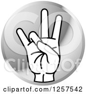 Round Silver Icon Of A Counting Hand Holding Up 7 Fingers Seven In Sign Language