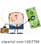 Happy White Businessman Holding Up A Giant Dollar Bill