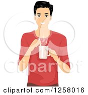 Happy Young Man Stirring A Cup Of Coffee