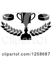 Clipart Of A Black And White Trophy Cup With Hockey Pucks Over Branches Royalty Free Vector Illustration