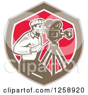Clipart Of A Retro Cameraman Filming In A Brown White And Pink Shield Royalty Free Vector Illustration