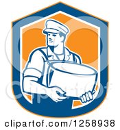 Retro Male Cheesemaker Holding A Parmesan Round In An Orange Blue And White Shield