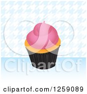 Clipart Of A Cupcake With Pink Frosting Over Blue Houndstooth Royalty Free Vector Illustration by Arena Creative