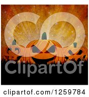 Clipart Of A Grungy Dark Halloween Background Of Jackolanterns Over Grass And Rays Royalty Free Illustration