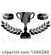 Clipart Of Black And White Hockey Pucks And A Trophy With A Laurel Royalty Free Vector Illustration