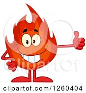 Clipart Of A Happy Fireball Flame Character Holding A Thumb Up Royalty Free Vector Illustration by Hit Toon