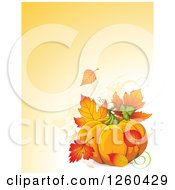 Thanksgiving Background With A Pumpkin And Autumn Fall Leaves Over Text Space