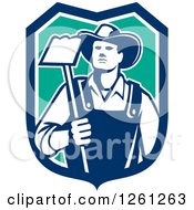 Poster, Art Print Of Retro Male Farmer Holding A Hoe In A Blue White And Turquoise Shield