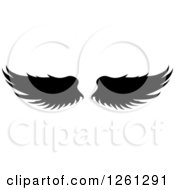 Clipart Of Black Silhouetted Feathered Wings Royalty Free Vector Illustration