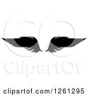 Clipart Of Black Silhouetted Feathered Wings Royalty Free Vector Illustration
