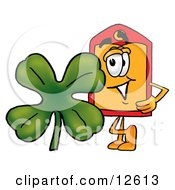 Clipart Picture Of A Price Tag Mascot Cartoon Character With A Green Four Leaf Clover On St Paddys Or St Patricks Day