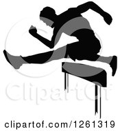 Poster, Art Print Of Black Silhouetted Male Athlete Runner Leaping Over A Hurdle