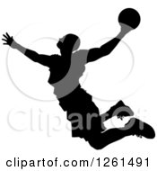 Clipart Of A Black Silhouetted Basketball Player In Action Royalty Free Vector Illustration