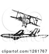 Clipart Of A Black And White Woodcut Biplane And Commercial Airliner Royalty Free Vector Illustration by xunantunich