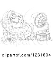 Black And White Santa Claus Sitting In A Chair And Listening To Music