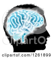 Poster, Art Print Of Silhouetted Mans Head With A Glowing Blue Brain