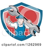Cartoon Male Mechanic Holding A Thumb Up And Carrying A Giant Wrench In A Blue White And Red Shield
