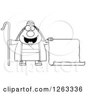 Clipart Of A Black And White Cartoon Chubby Male Shepherd Holding A Scroll Royalty Free Vector Illustration