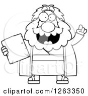 Black And White Cartoon Smart Chubby Moses Holding A Tablet With An Idea