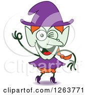 Clipart Of A Halloween Witch Winking Royalty Free Vector Illustration by Zooco