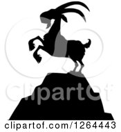 Poster, Art Print Of Black Silhouetted Rearing Buck Goat On A Mountain Top