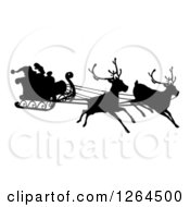 Black Silhouette Of Reindeer Flying Santa In His Sleigh