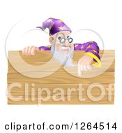 Clipart Of A Senior Male Wizard Pointing Down At A Wooden Sign Royalty Free Vector Illustration