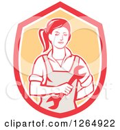 Poster, Art Print Of Retro Female Mechanic Holding A Wrench In A Red White And Orange Shield