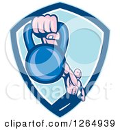 Clipart Of A Retro Male Bodybuilder Working Out With A Kettlebell In A Blue And White Shield Royalty Free Vector Illustration