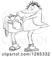 Clipart Of A Black And White Cavewoman Carrying A Basket Of Laundry Royalty Free Vector Illustration
