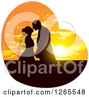 Poster, Art Print Of Silhouetted Wedding Couple Kissing In A Sunset Heart