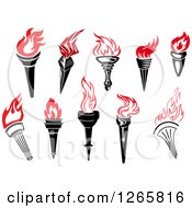 Clipart Of Black Handled Torches With Red Flames Royalty Free Vector Illustration