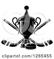 Clipart Of A Black And White Trophy With A Hockey Puck And Crossed Sticks Royalty Free Vector Illustration by Vector Tradition SM