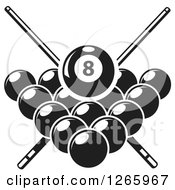 Black And White Billiards Pool Eight Ball And Crossed Cue Sticks Over Other Balls