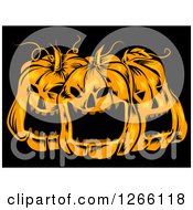 Trio Of Spooky Halloween Jackolantern Pumpkins On Black