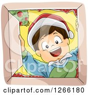 Poster, Art Print Of Happy Caucasian Boy Wearing A Santa Hat And Looking Down Into A Christmas Gift Box