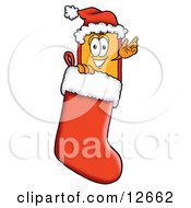 Clipart Picture Of A Price Tag Mascot Cartoon Character Wearing A Santa Hat Inside A Red Christmas Stocking by Mascot Junction