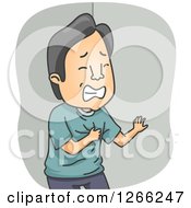 Asian Man Clutching His Chest During A Heart Attack