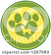 Clipart Of A Green And Yellow Circle Of A Silhouetted Dog In A Heart Shaped Paw Print Royalty Free Vector Illustration